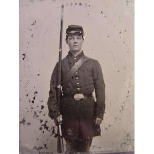   soldier in Union uniform with bayoneted musket