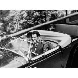  Young Couple in Vintage Soft Top Car With Golf Clubs on 