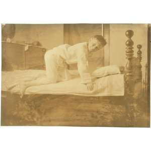  Photo Miscellaneous. Boy climbing into bed. 1924