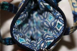 mod floral pattern graces this dark navy coin case/keychain. This 