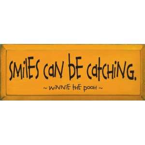  Smiles can be catching. ~ Winnie the Pooh Wooden Sign 