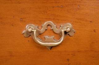 These pierced brass pulls fit perfectly with the rustic style of this 