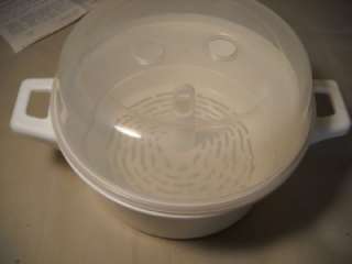 UP FOR AUCTION IS A CHARTER MICROWAVE STEAMER COOKER 1 QT. W/BOX 