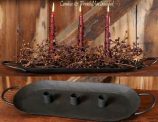This is a new primitive style item. It is a black wrought iron candle 