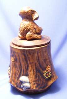 PUPPY ON A TREE STUMP COOKIE JAR WITH NUMBER IN LID.  